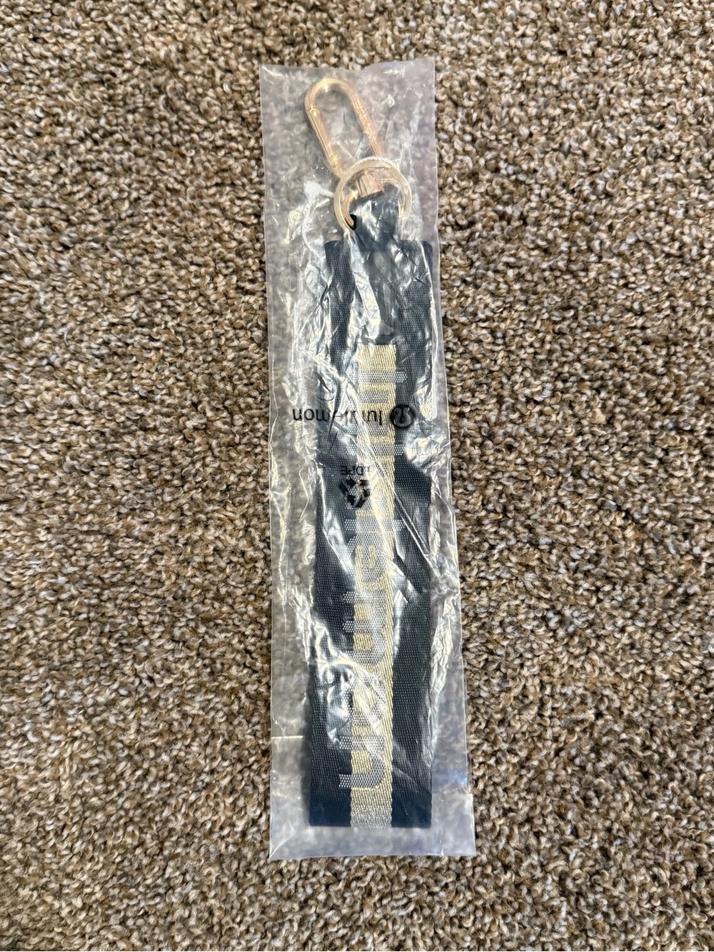 Lululemon Never Lost Keychain in black and metallic gold BNWT